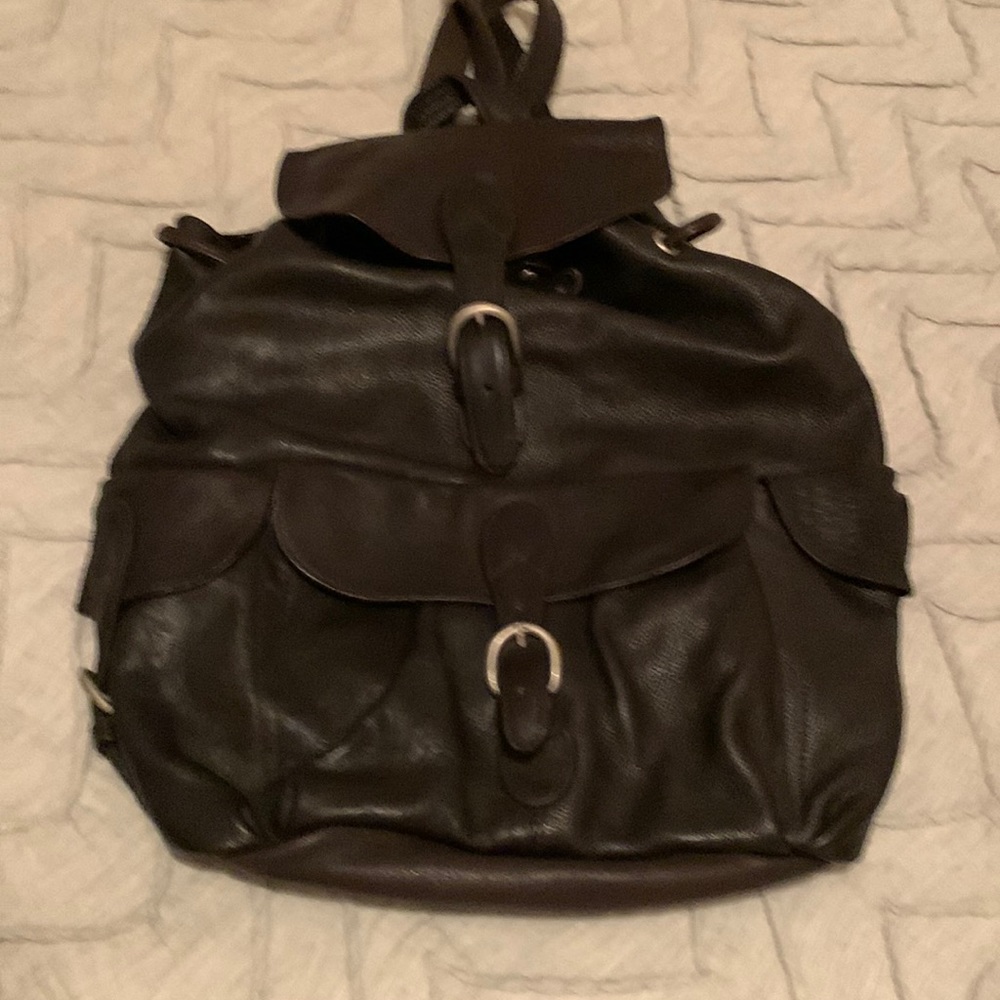 Soft leather gently used London Fog Backpack. Unisex